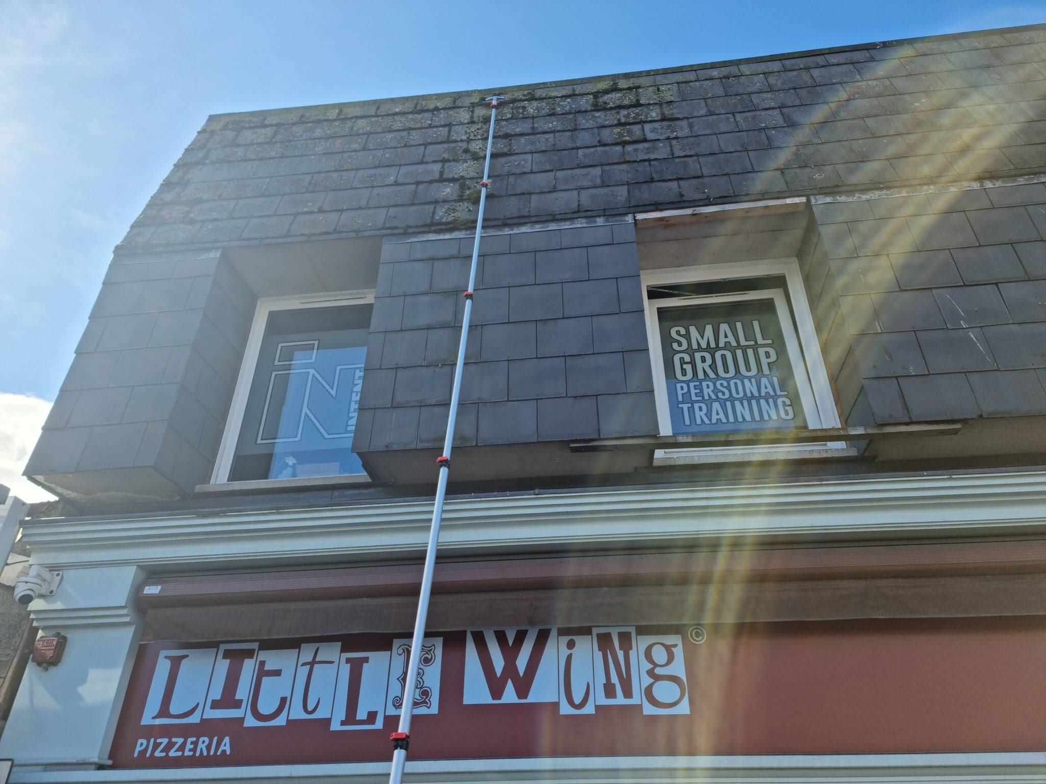 C-thru Window Cleaning Specialists cleaning high widows and gutters